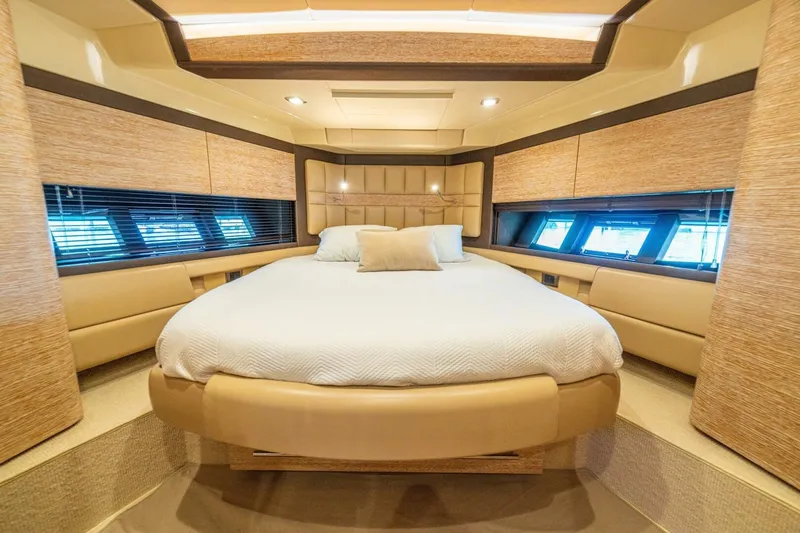 Costa Luna Yacht Photos Pics Luxurious bedroom interior of 2014 Azimut 64 yacht with elegant design and cozy bedding.