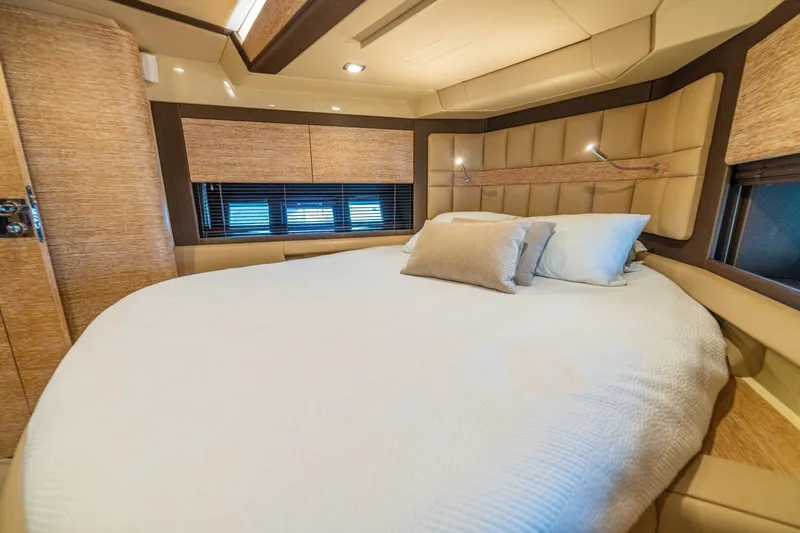 Costa Luna Yacht Photos Pics Luxurious bedroom interior of 2014 Azimut 64 yacht with plush bedding and modern design.