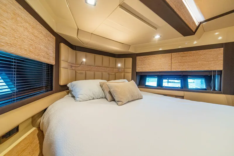 Costa Luna Yacht Photos Pics Luxurious bedroom interior of 2014 Azimut 64 yacht with elegant bedding and modern design.
