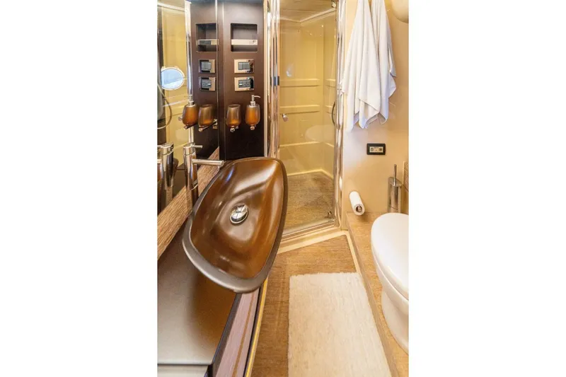 Costa Luna Yacht Photos Pics Luxurious bathroom in 2014 Azimut 64 yacht with modern fixtures and elegant design.