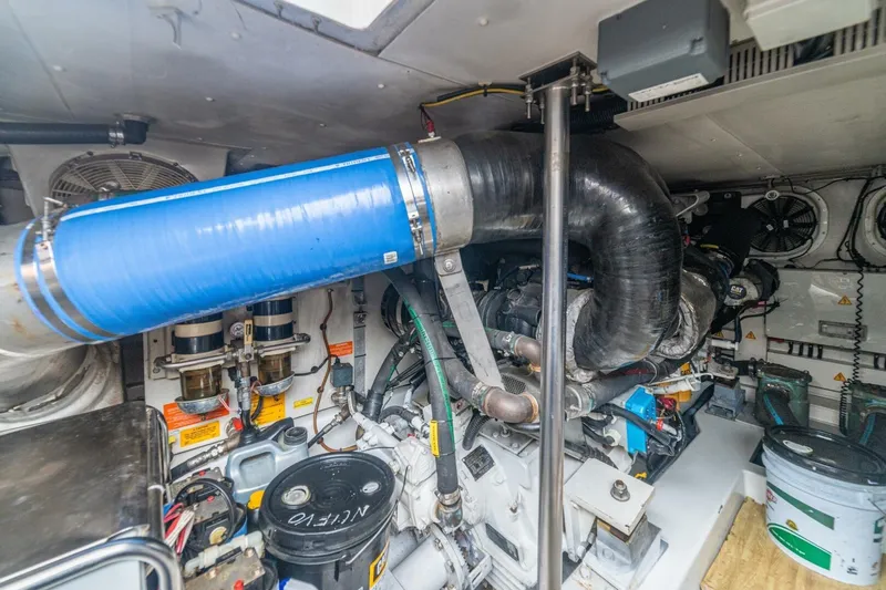 Costa Luna Yacht Photos Pics Engine room of a 2014 Azimut 64 yacht, featuring complex machinery and components.