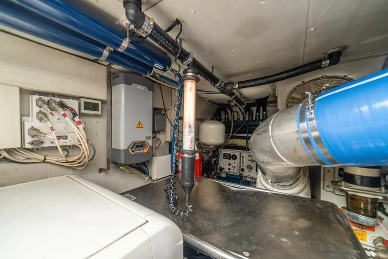 Costa Luna Yacht Photos Pics Engine room of a 2014 Azimut 64 yacht, showcasing mechanical and electrical systems.
