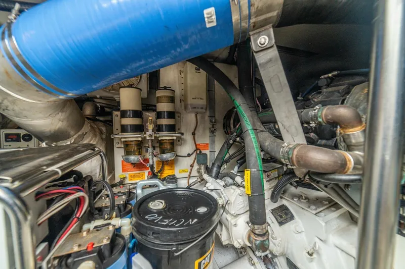 Costa Luna Yacht Photos Pics Engine room of a 2014 Azimut 64 yacht, showcasing complex machinery and components.