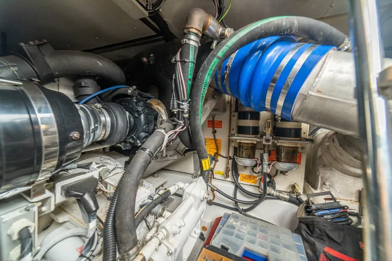 Costa Luna Yacht Photos Pics Engine room of 2014 Azimut 64 yacht, showcasing complex machinery and components.