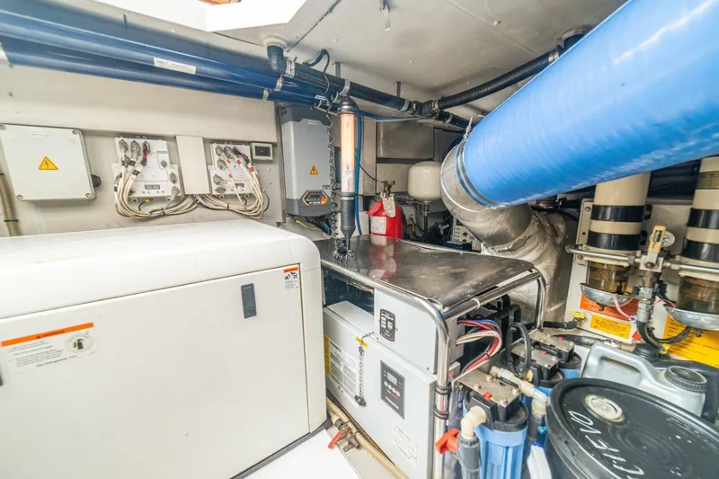 Costa Luna Yacht Photos Pics Engine room of a 2014 Azimut 64 yacht, featuring mechanical and electrical systems.