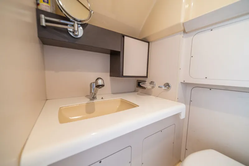 Costa Luna Yacht Photos Pics Luxurious bathroom sink area in 2014 Azimut 64 yacht, featuring modern fixtures.