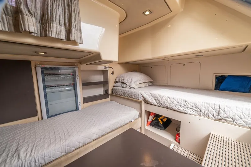 Costa Luna Yacht Photos Pics 2014 Azimut 64 yacht interior with twin beds and storage compartments.