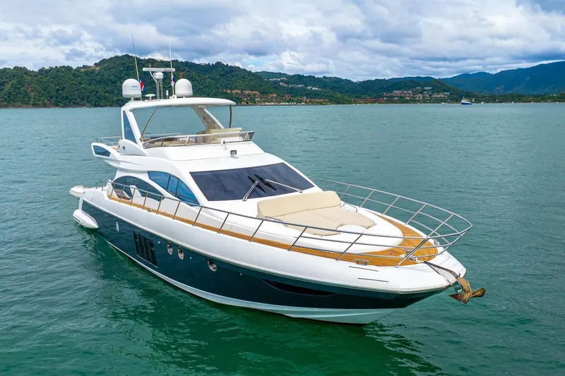 Costa Luna Yacht Photos Pics Luxurious 2014 Azimut 64 yacht cruising on serene waters with scenic mountain backdrop.