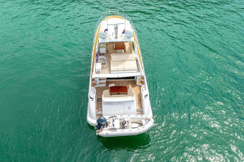 Costa Luna Yacht Photos Pics Aerial view of 2014 Azimut 64 yacht on turquoise water.