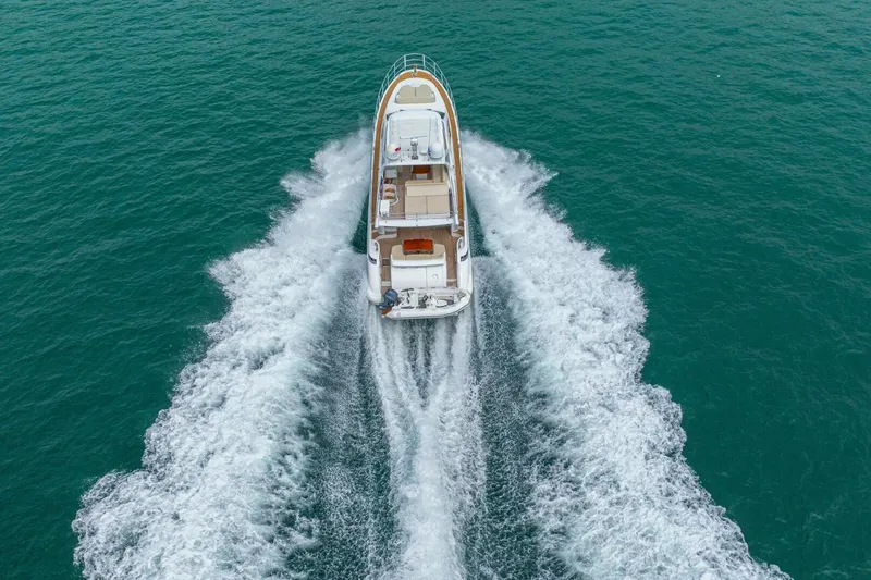 Costa Luna Yacht Photos Pics Aerial view of 2014 Azimut 64 yacht cruising on open water.