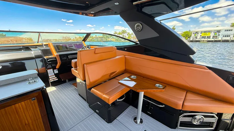 Black Diamond Yacht Photos Pics 2022 Cruisers Yachts 38 GLS interior with leather seating and modern dashboard.