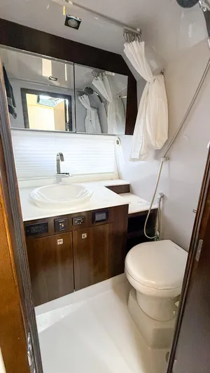 Black Diamond Yacht Photos Pics Luxurious bathroom in 2022 Cruisers Yachts 38 GLS with modern fixtures and elegant design.