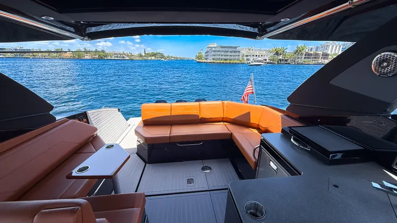 Black Diamond Yacht Photos Pics 2022 Cruisers Yachts 38 GLS interior with luxurious seating and scenic waterfront view.