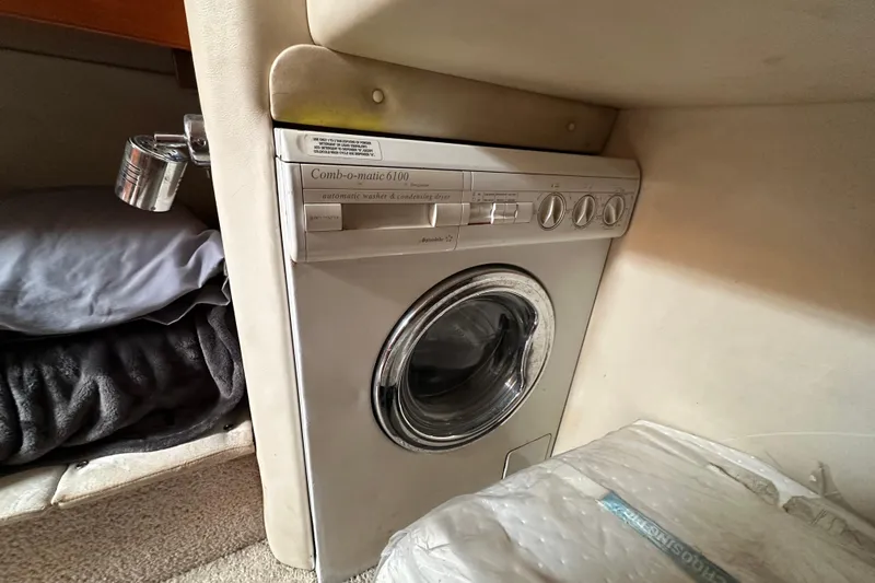Game On Yacht Photos Pics Compact washer in 2002 Riviera 40 Flybridge yacht interior.