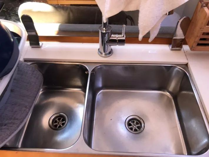  Yacht Photos Pics Stainless steel double sink on 2011 Jeanneau Sun Odyssey 409 yacht kitchen.