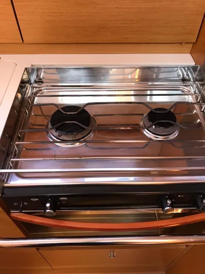  Yacht Photos Pics Stainless steel two-burner stove in 2011 Jeanneau Sun Odyssey 409 yacht kitchen.