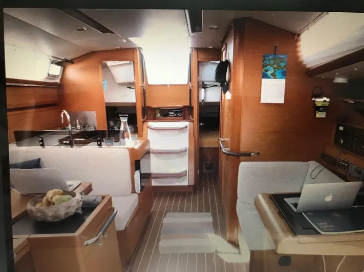  Yacht Photos Pics Interior of 2011 Jeanneau Sun Odyssey 409 yacht with modern kitchen and seating area.