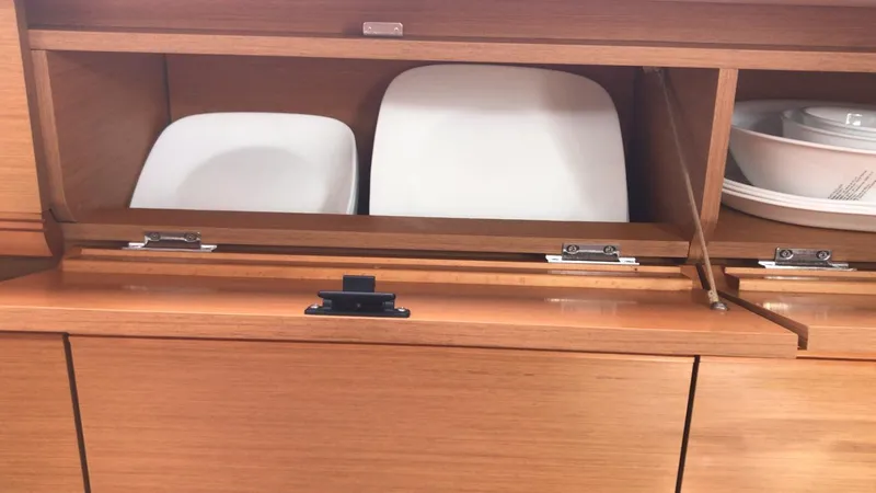 Yacht Photos Pics Wooden cabinet with white plates inside, Jeanneau Sun Odyssey 409, 2011 model.