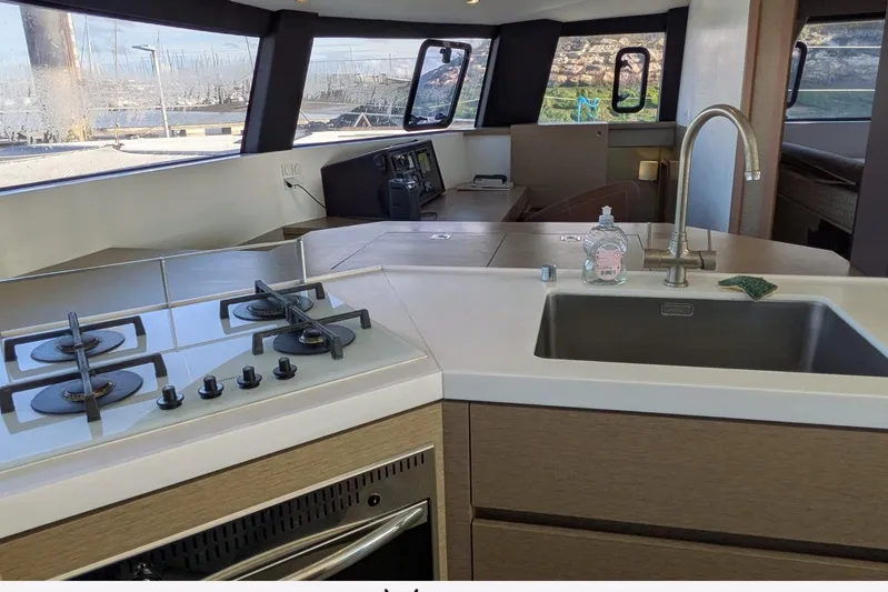  Yacht Photos Pics Modern kitchen interior of 2018 NEEL 51 yacht with stove and sink.