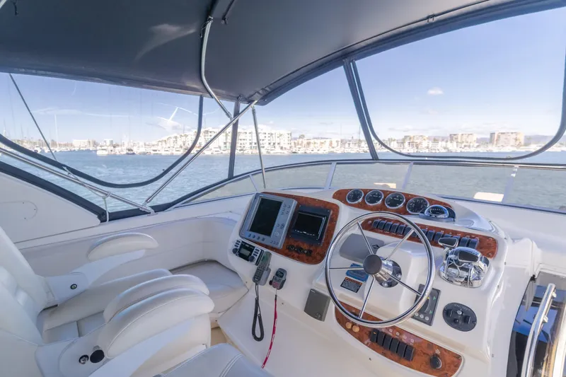 Jolie Vie Yacht Photos Pics 2004 Meridian 540 Pilothouse yacht interior with steering wheel and navigation equipment.