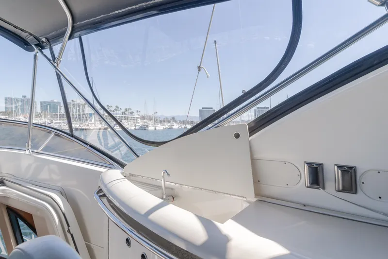 Jolie Vie Yacht Photos Pics 2004 Meridian 540 Pilothouse yacht interior with marina view through windows.