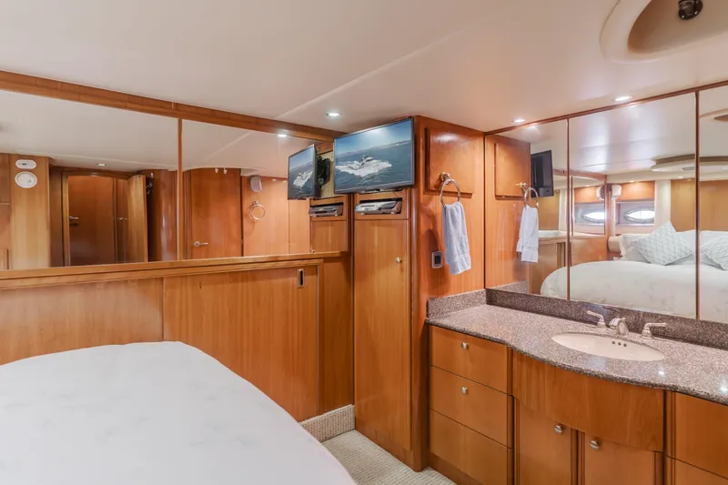 Jolie Vie Yacht Photos Pics Luxurious interior of 2004 Meridian 540 Pilothouse yacht with wood cabinetry and mirrored walls.