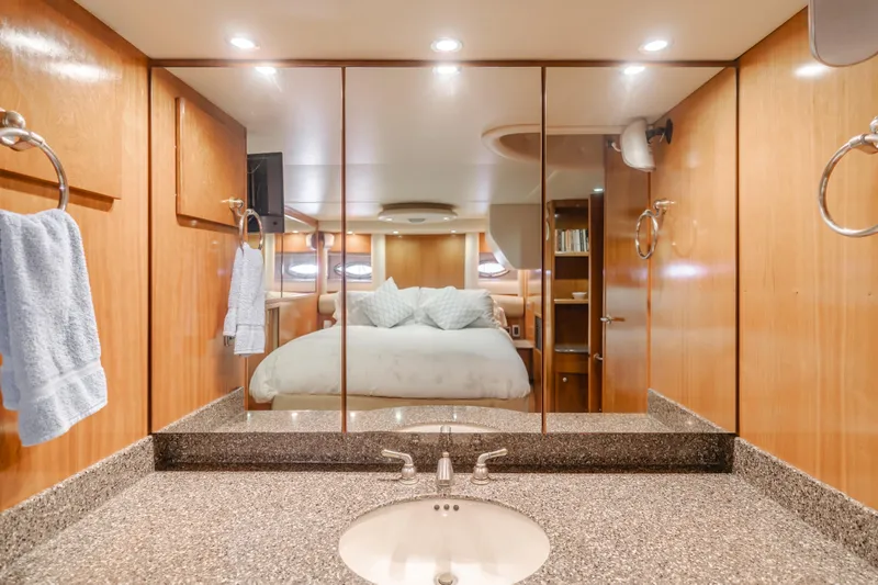 Jolie Vie Yacht Photos Pics Luxurious bathroom in 2004 Meridian 540 Pilothouse yacht with mirrored cabinets and granite countertop.