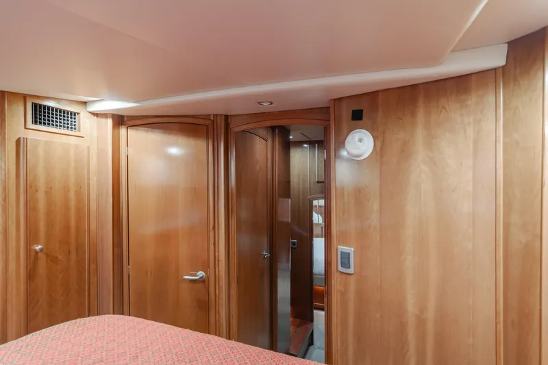 Jolie Vie Yacht Photos Pics Interior of 2004 Meridian 540 Pilothouse with wooden doors and cozy cabin design.