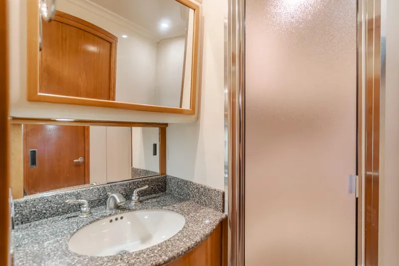 Jolie Vie Yacht Photos Pics 2004 Meridian 540 Pilothouse bathroom with granite countertop and frosted glass shower.