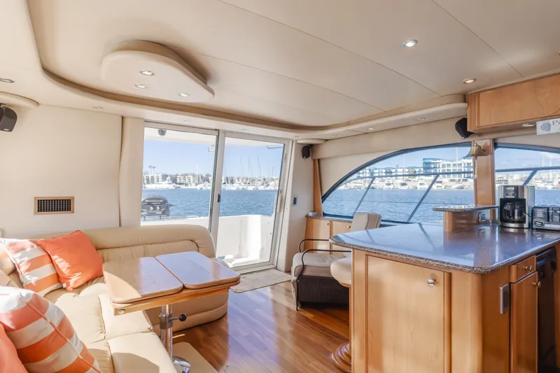 Jolie Vie Yacht Photos Pics Luxurious interior of 2004 Meridian 540 Pilothouse yacht with scenic ocean view.