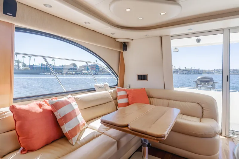 Jolie Vie Yacht Photos Pics Luxurious interior of 2004 Meridian 540 Pilothouse yacht with waterfront view.