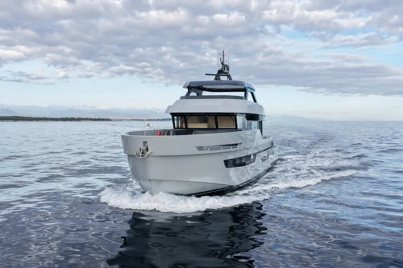  Yacht Photos Pics Luxury 2026 Outer Reef Yachts 780 Adventure cruising on open water under cloudy sky.