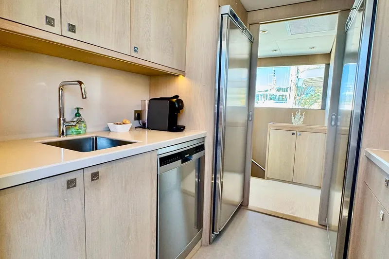  Yacht Photos Pics Modern kitchen interior of 2026 Outer Reef Yachts 780 Adventure, featuring sleek appliances and cabinetry.