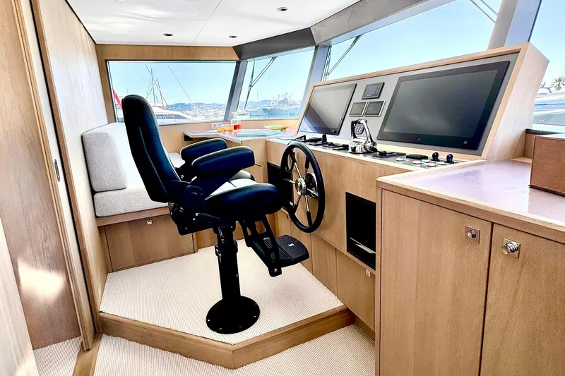  Yacht Photos Pics Modern helm station of 2026 Outer Reef Yachts 780 Adventure with sleek controls and seating.