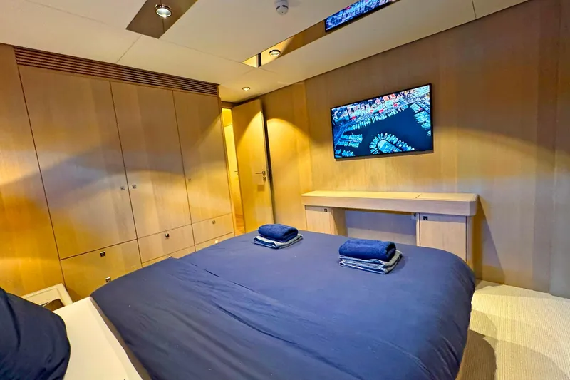  Yacht Photos Pics Luxurious bedroom interior of 2026 Outer Reef Yachts 780 Adventure with modern amenities.