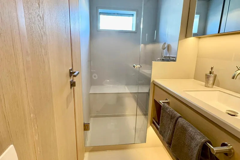  Yacht Photos Pics Modern bathroom on 2026 Outer Reef Yachts 780 Adventure, featuring sleek design and glass shower.
