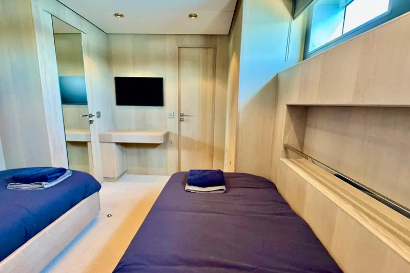  Yacht Photos Pics Luxurious cabin interior of 2026 Outer Reef Yachts 780 Adventure with twin beds and modern decor.