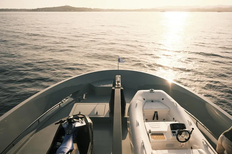  Yacht Photos Pics Outer Reef Yachts 780 Adventure 2026, featuring a jet ski and tender on deck at sunset.