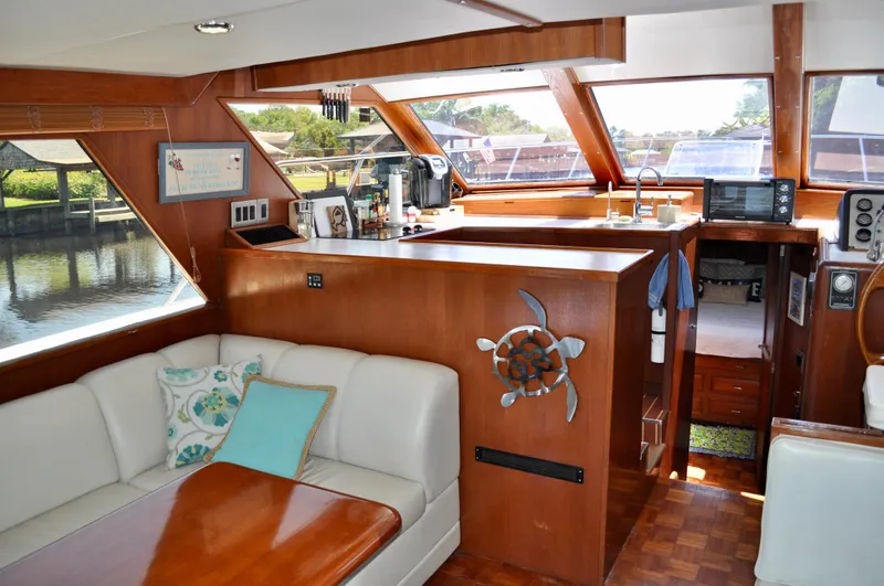 Freakin' Awesome Yacht Photos Pics Interior of 1990 Ocean Alexander 42 Sedan yacht with wood accents and comfortable seating.