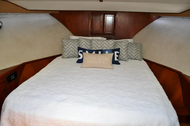 Freakin' Awesome Yacht Photos Pics Cozy bedroom in 1990 Ocean Alexander 42 Sedan yacht with decorative pillows.