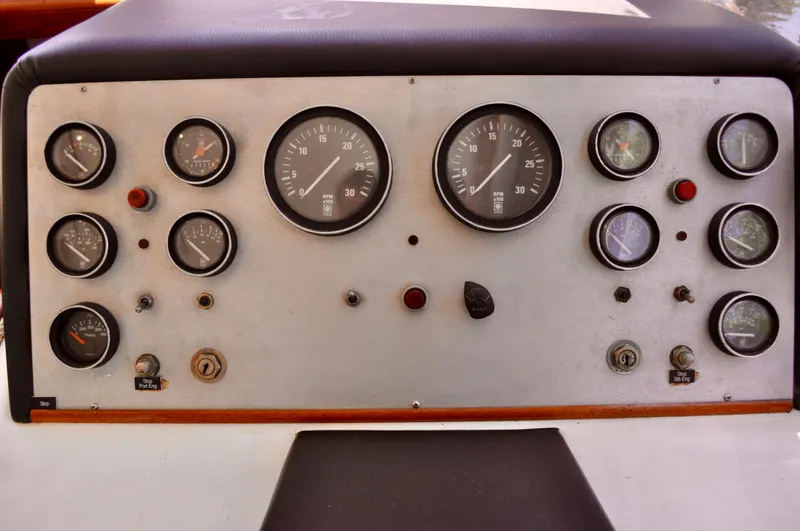 Freakin' Awesome Yacht Photos Pics Instrument panel of a 1990 Ocean Alexander 42 Sedan yacht with various gauges and controls.