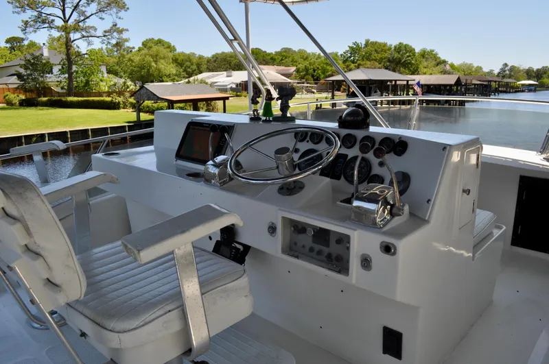 Freakin' Awesome Yacht Photos Pics Helm of 1990 Ocean Alexander 42 Sedan yacht with steering wheel and controls.
