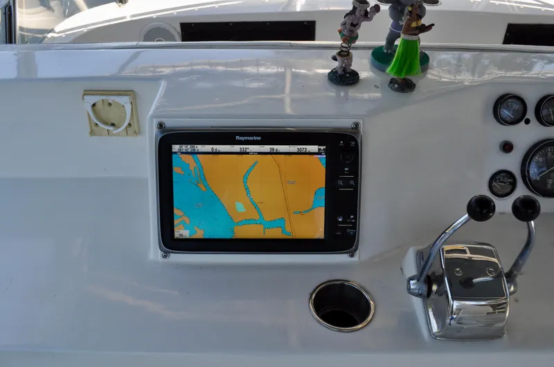 Freakin' Awesome Yacht Photos Pics Control panel of a 1990 Ocean Alexander 42 Sedan with navigation display.