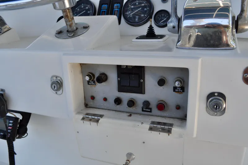 Freakin' Awesome Yacht Photos Pics Control panel of a 1990 Ocean Alexander 42 Sedan yacht with gauges and switches.