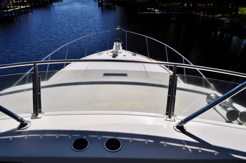 Freakin' Awesome Yacht Photos Pics 1990 Ocean Alexander 42 Sedan yacht bow view on calm waterway.