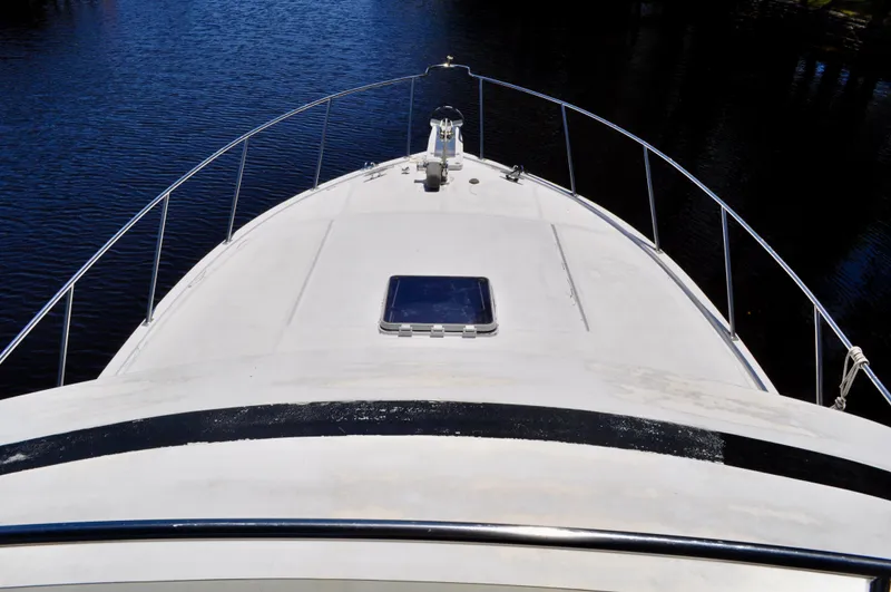 Freakin' Awesome Yacht Photos Pics 1990 Ocean Alexander 42 Sedan yacht bow view on calm water.
