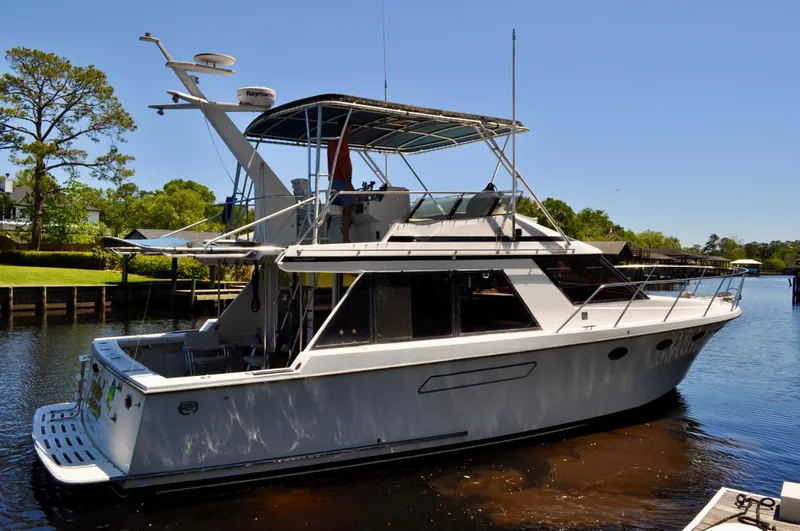 Freakin' Awesome Yacht Photos Pics 1990 Ocean Alexander 42 Sedan yacht docked on a sunny day.