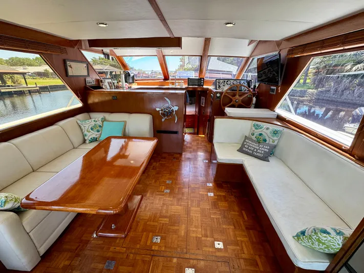 Freakin' Awesome Yacht Photos Pics Interior of 1990 Ocean Alexander 42 Sedan yacht with elegant seating and wooden accents.