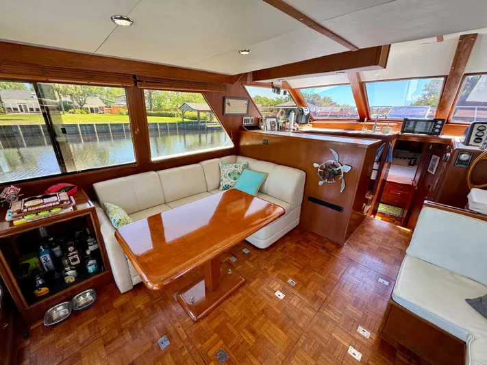 Freakin' Awesome Yacht Photos Pics Luxurious interior of 1990 Ocean Alexander 42 Sedan yacht with elegant wood finishes.