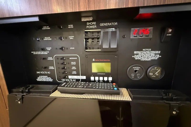 Bon Voyage Yacht Photos Pics Control panel of a 2019 Pursuit OS 355 Offshore boat, featuring power switches and gauges.